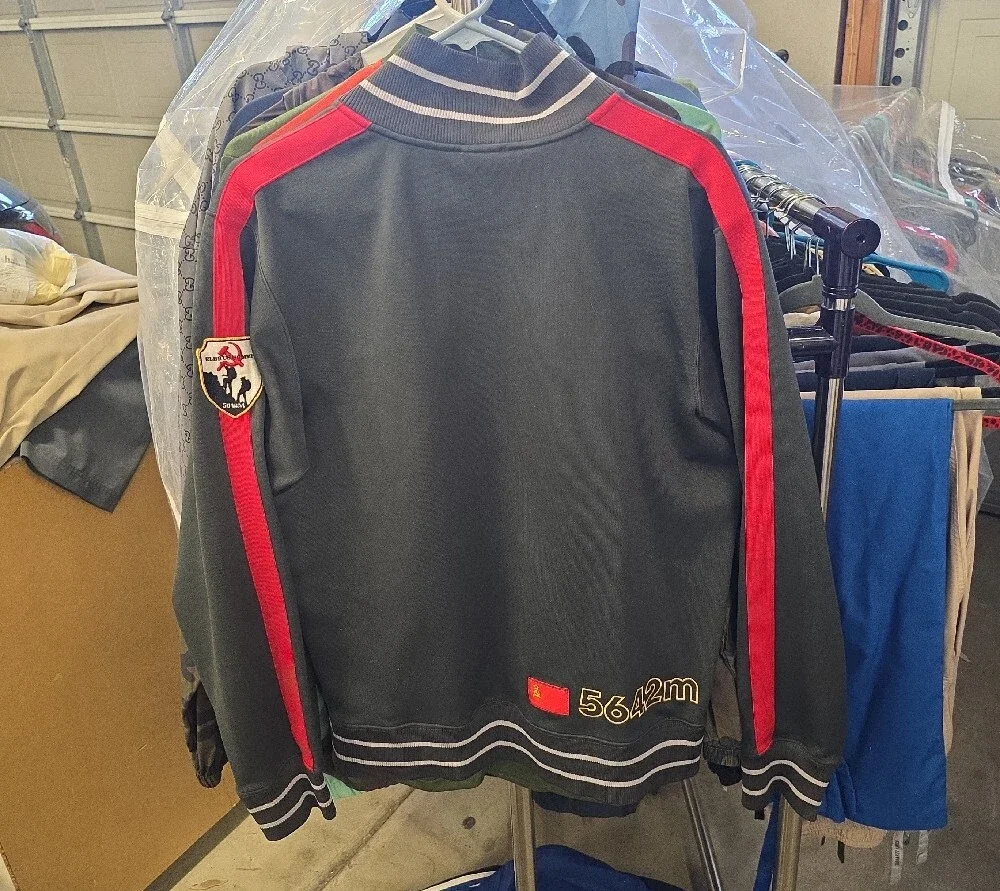 The North Face Dark Green Track Jacket with Red & Yellow Accents